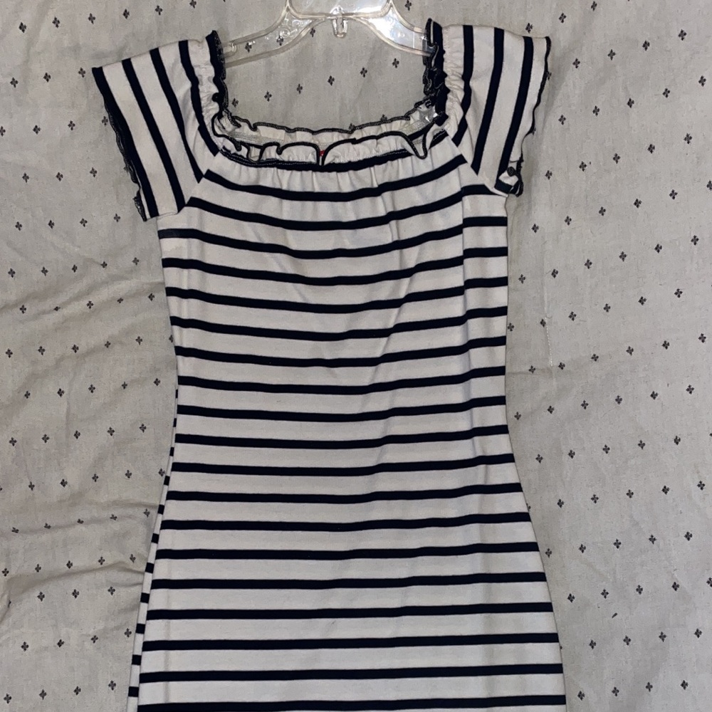 Guess tight fit dress with small ruffle details on hemlines.